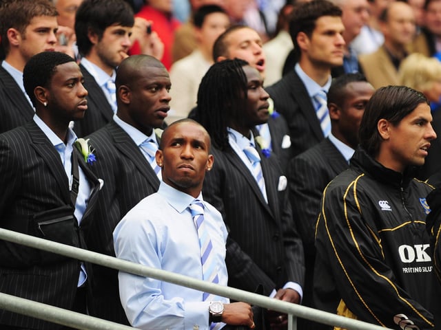 Cup-tied Jermain Defoe of Portsmouth looks on during the anthems. Photo by Shaun Botterill/Getty Images
