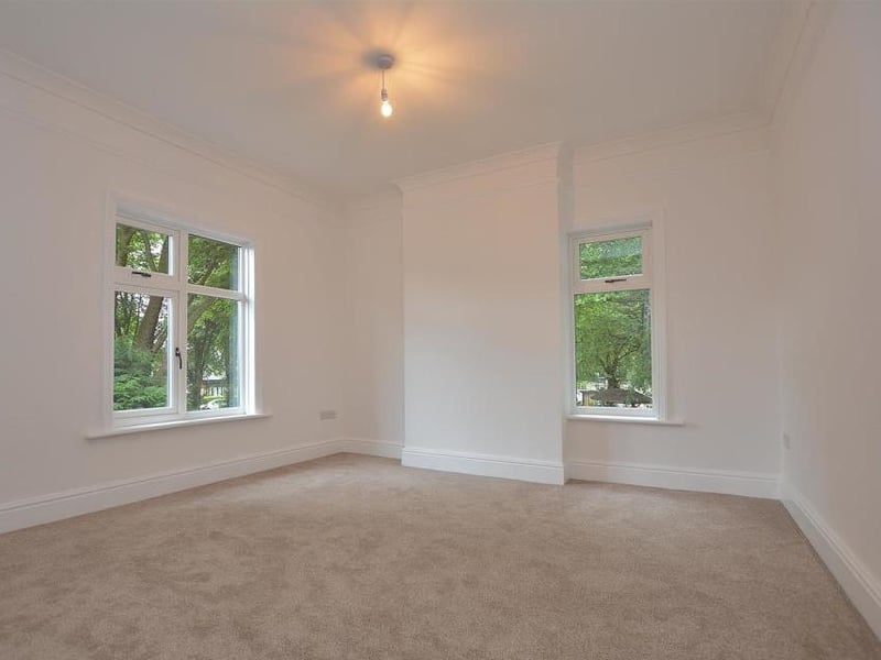 Another spacious bedroom, which includes a a ceiling-light point, original feature coving, skirting boards and panelling. All part of the unique character of this High Oakham Road property.
