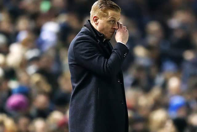 Garry Monk looks on as his Wednesday side battle to contain City.