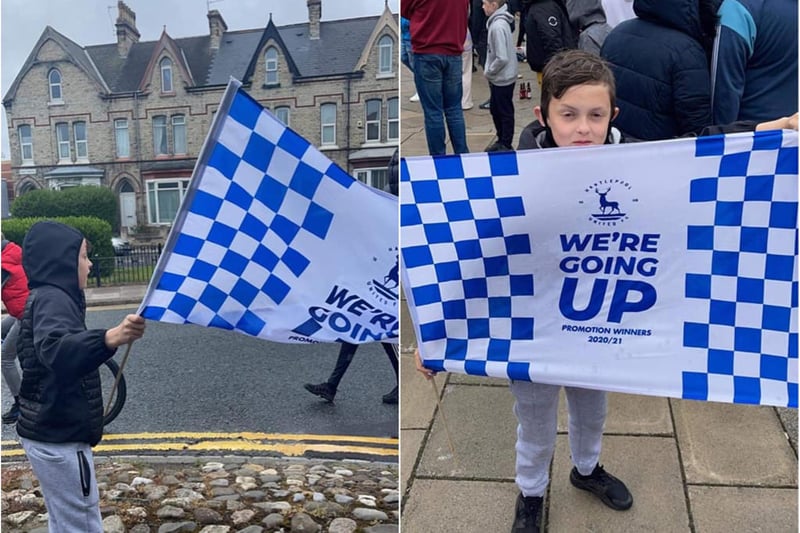One young supporter flying his flag for Pools!