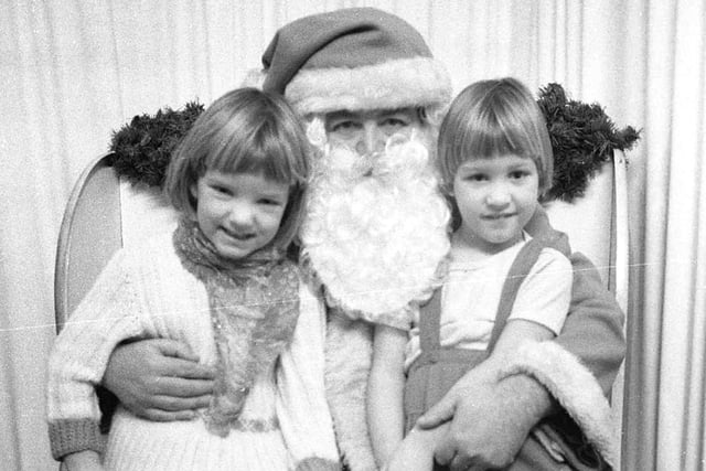 Two young girls pictured with Santa in the Binns store. Did you visit Santa when he came to Binns?