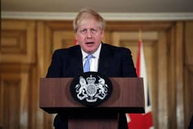 UK Prime Minister Boris Johnson speaks and takes questions during a press conference in Downing Street regarding the coronavirus outbreak (Alberto Pezzali - WPA Pool/Getty Images)