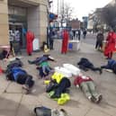 A die-in outside Barclays in Sheffield city centre, organised by Extinction Rebellion in protest at the bank's investment in fossil fuels