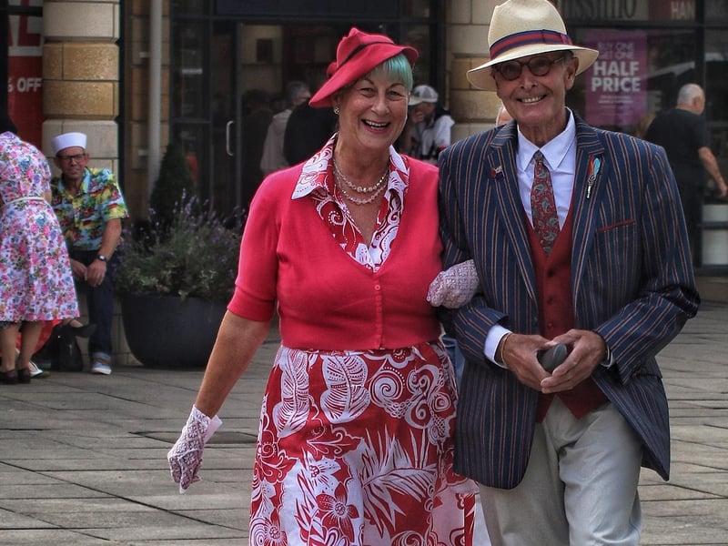 A couple in 1940s clothes.