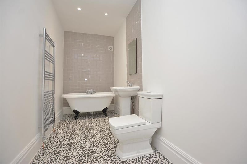 A large family-bathroom that perfectly harnesses the charming, original style of the house, while adding a modern twist. At the heart of it is a free-standing bath with separate shower handset, plus a hand basin, low-flush WC and a chrome, heated towel-rail.