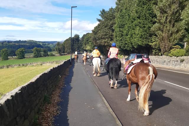 Horse rders make their way as they raise the issue of how to safely pass horses