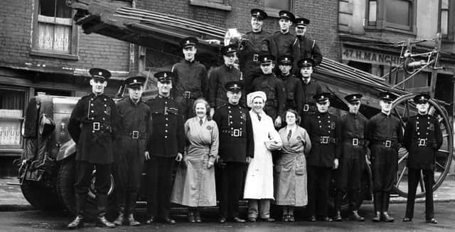 Auxiliary firemen and canteen staff pose with their appliance possibly in London Road. 
Picture: George French collection