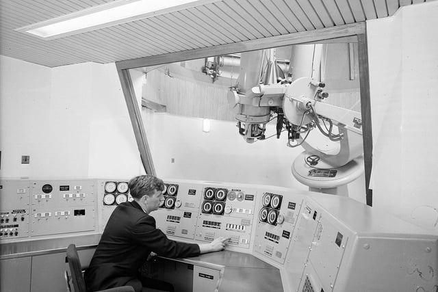 Mr Wilfred Jones, an electronic engineer, demonstrates how the twin 16-inch telescopes respond to messages from the control panel at the Royal Observatory on Blackford Hill in June 1965.