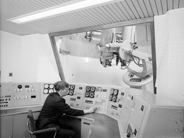 Mr Wilfred Jones, an electronic engineer, demonstrates how the twin 16-inch telescopes respond to messages from the control panel at the Royal Observatory on Blackford Hill in June 1965.