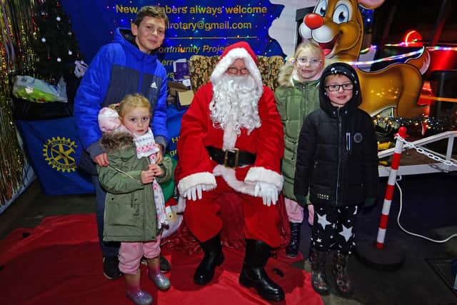 Children from the Humphreys family with Santa