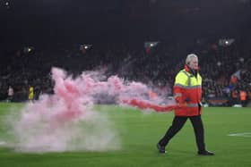 A flare is removed from the Bramall Lane pitch after Rotherham United's winner against Sheffield United: Nigel French/PA Wire.