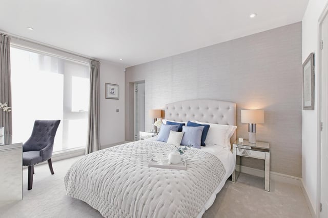 The master bedroom is light and bright, with a contemporary finish.