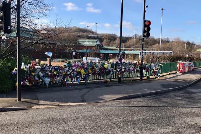 Flowers have been left on Meadowhall Way following the deaths of Tommy and Josh Hydes in a crash on Saturday night