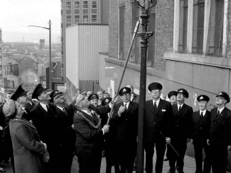 Lord Provost of Glasgow Sir Donald Liddle lights the last Glasgow gas street lamp in September 1971.