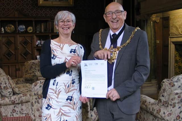 Julie Pearn, chair of Sheffield Labour Friends of Palestine, handing a letter to the Lord Mayor of Sheffield, Coun Tony Downing from the Mayor of Nablus in 2019, inviting the two cities to enter a twinning arrangement