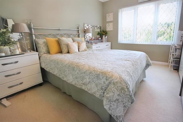 The master bedroom is also deceptively large. It has plenty of space for additional storage and furniture as well as this large bed.