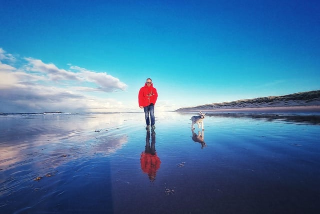One man and his dog enjoy a stroll at Bamburgh beach back in April.