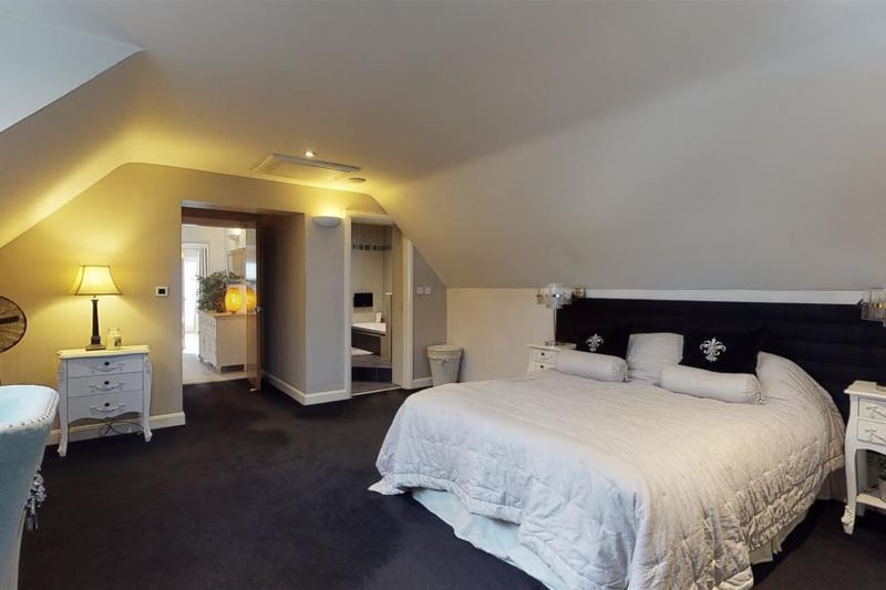 The master bedroom on the first floor is complete with a spa bath and large walk in shower cubicle.