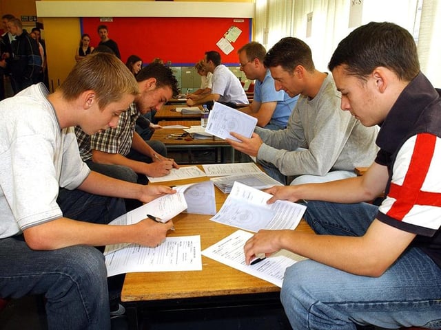 Successful GCSE results at Myers Grove School, Wood Lane, Stannington. Candidates get their results in the staff room in August 2003