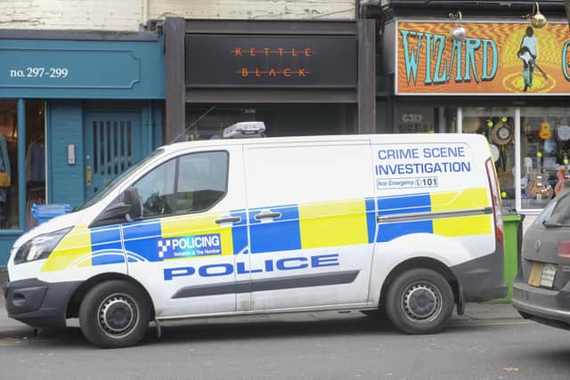 Police search the area following shooting at the Kettle Black bar on Ecclesall Road, Sheffield.