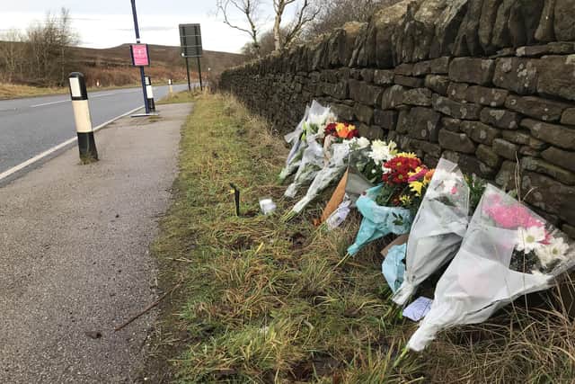 Flowers at the scene of a fatal crash on Hathersage Road, Dore.