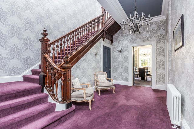 A truly regal hallway leading through to the ground floor accommodation, original ornate stairwell rising to the first floor. Ceiling coving and skirting boards, utility and storage room off.