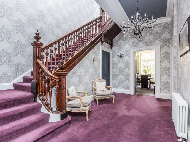 A truly regal hallway leading through to the ground floor accommodation, original ornate stairwell rising to the first floor. Ceiling coving and skirting boards, utility and storage room off.