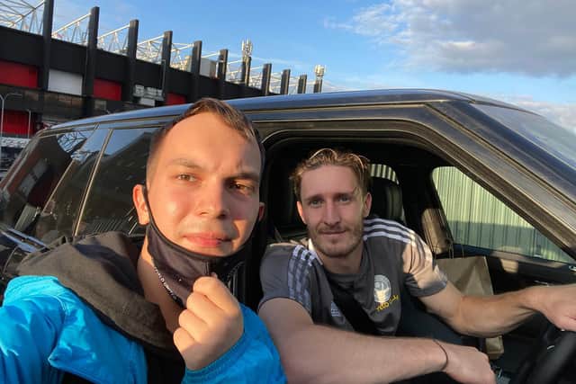 Russian Sheffield United fan Yaroslav Matveev with Sheffield United defender Ben Daies, on loan from Liverpool