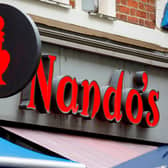 Nando's has closed two of its restaurants in Sheffield with other working on reduced menus and opening hours in light of a staff shortage with its supplier. Photo by TOLGA AKMEN/AFP via Getty Images.