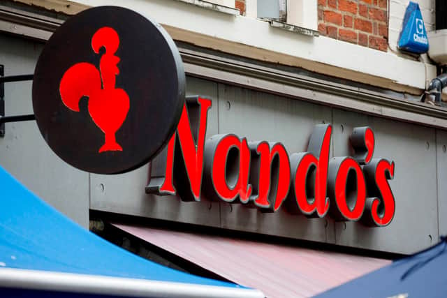 Nando's has closed two of its restaurants in Sheffield with other working on reduced menus and opening hours in light of a staff shortage with its supplier. Photo by TOLGA AKMEN/AFP via Getty Images.