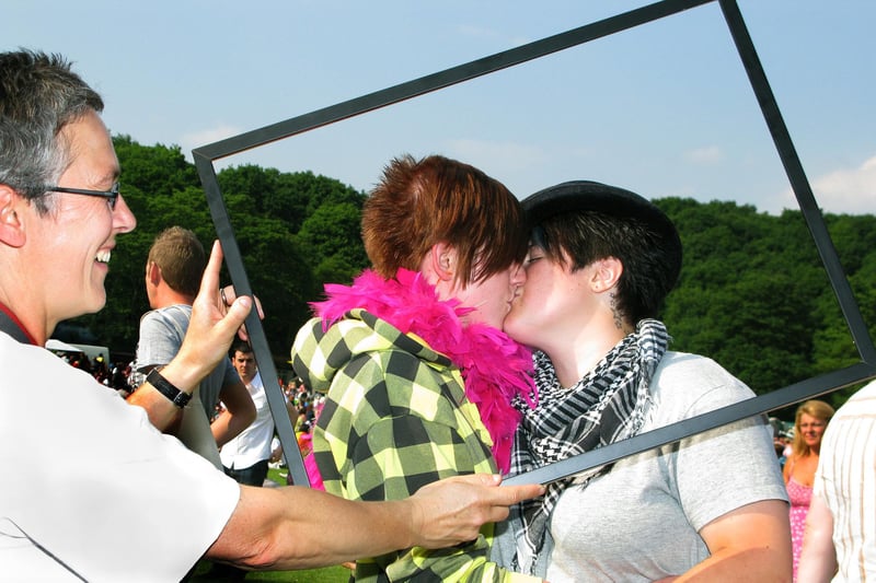 Danni Purcell (middle) and Brady Hodgkinson being put in the frame by civil partnership photographer Evelyne Sansot of In The Pink Photography at Sheffield Pride 2010
