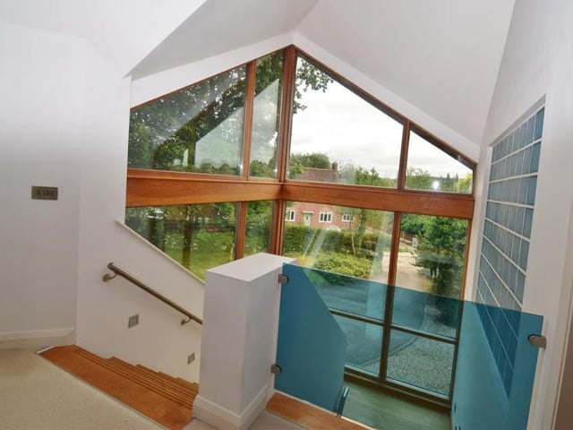 Moving upstairs towards the first floor, and a view from the galleried landing, with its vaulted ceiling. On the landing, there is an upright radiator., an airing cupboard and access to the loft, which has potential for development.