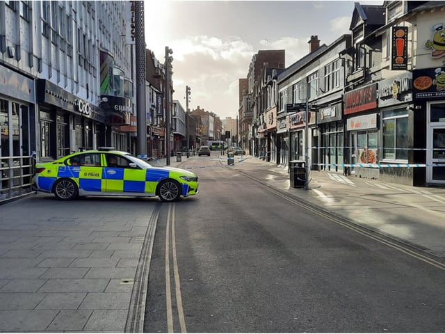 A police car guards the scene in Silver Street.