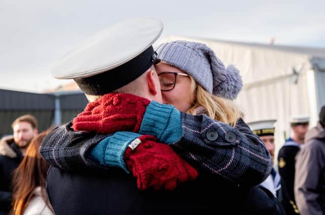 Couple embracing in front of HMS Defender. Picture: Habibur Rahman