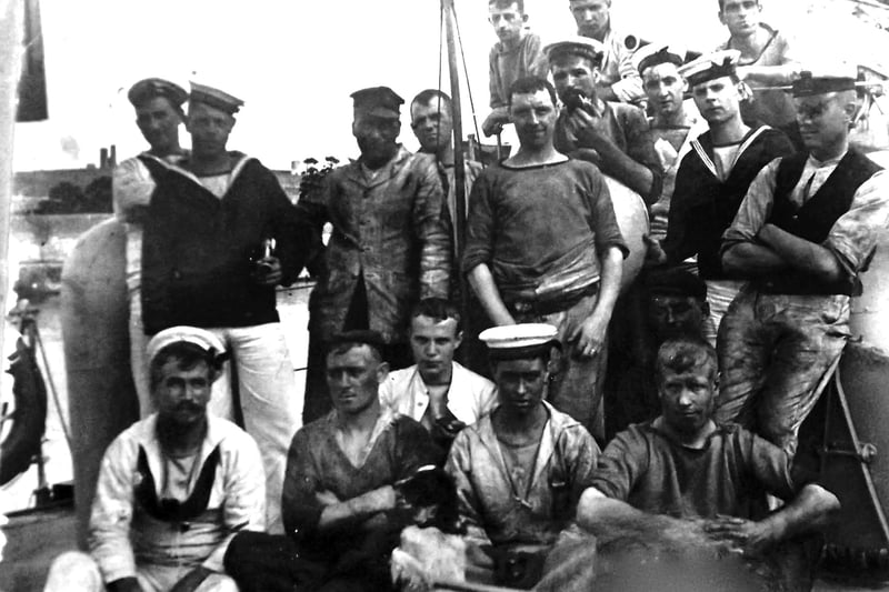 Some of the crew from the turtle-back destroyer HMS Chamois. 
Bottom centre of the photograph is the ships pet and to the left of it is George Harwood. He was the grandfather of George Millener who loaned us the photographs. Picture: George Millener collection