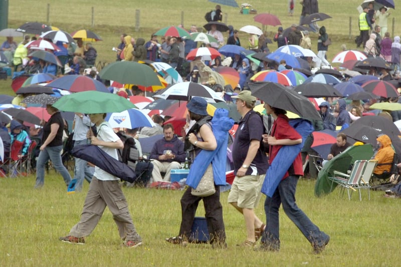 The crowds settle down in the rain at The Pastures.