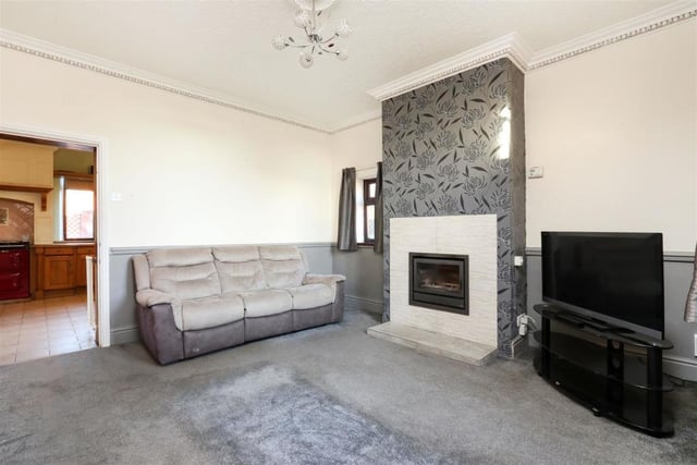 A modern fire set into the chimney breast is a focal point of this room.