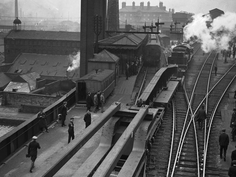 A goods train of special wagons of the London and North Eastern Railway (LNER) passing through Sheffield Victoria Station in 1930.