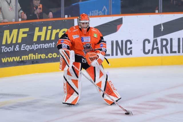 Matt Greenfield playing the puck. Pic by Dean Woolley