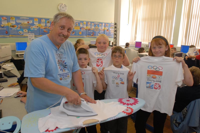 Key Stage 3 co-ordinator John Bennett got a helping hand from pupils from Monkton Junior School as they held a T-shirt making tribute to the Olympics at South Shields Community School in 2008.