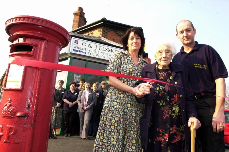 101 year-old Doris Ramsden cut the tape to officially reopen the newly refurbished Wheatley Hills Post Office in Thorne Road.. Looking on is subpostmistress Jackie Elsmore and her husband Gary Elsmore in 2002