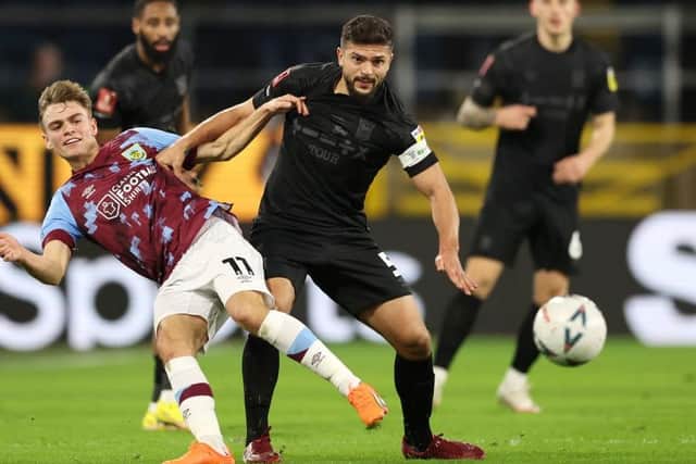 BURNLEY, ENGLAND - FEBRUARY 07: Sam Morsy of Ipswich Town battles for possession with Scott Twine of Burnley during the Emirates FA Cup Fourth Round Replay match between Burnley and Ipswich Town at Turf Moor on February 07, 2023 in Burnley, England. (Photo by Clive Brunskill/Getty Images)