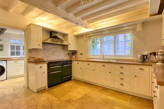 The breakfast kitchen has been fitted with farmhouse-style units and wood-effect work surfaces. Other highlights include a Rangemaster multi-fuel range cooker with extractor canopy over, integrated dishwasher, tiled floor, ceiling spotlights, window shutters to the front and beamed ceiling.