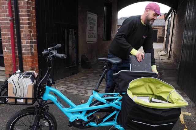 Darren Jarvis with a paperwork load for the 'medium' e-cargo bike from Russell's Bicycle Shed Deliveries