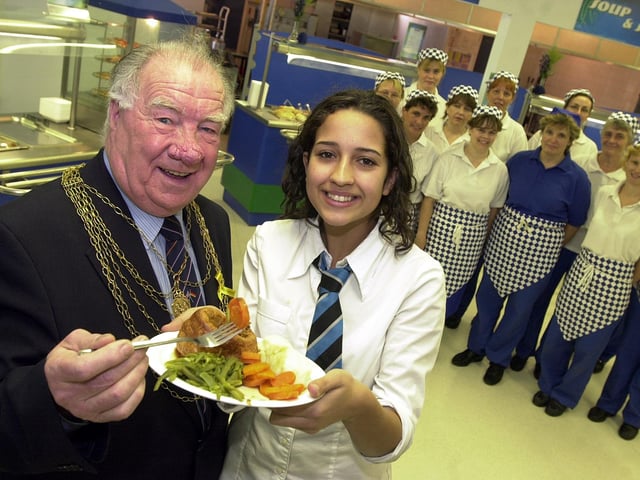The Civic Mayor of Doncaster, Councillor John Quinn, tucked into a meal at Ridgewood School's new Dimensions food court back in 2002. Looking on is pupil Hanna Flint, aged 14, and food court staff.