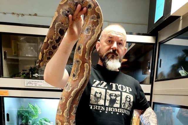 Charles Thompson with a snake. The cost-of-living crisis is forcing exotic pet owners to abandon their animals