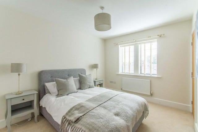 Bedroom Three - A double room with a rear facing double glazed window and a central heating radiator.