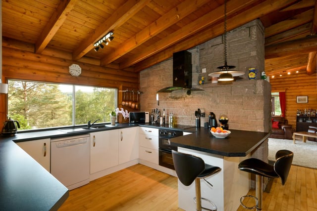 The modern fitted kitchen has views to the garden