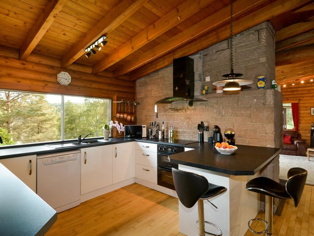 The modern fitted kitchen has views to the garden