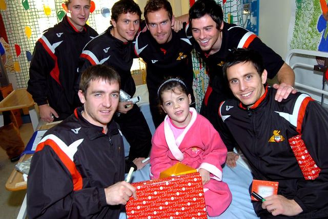 Wade Fairhurst, Jon Spicer, Martin Woods,  Gordon Greer, Paul Heffernan and Brian Stock hand over a Christmas present to six-year-old Shelby Pilling of Denaby, during the players visit to Doncaster Royal Infirmary at Christmas 2008